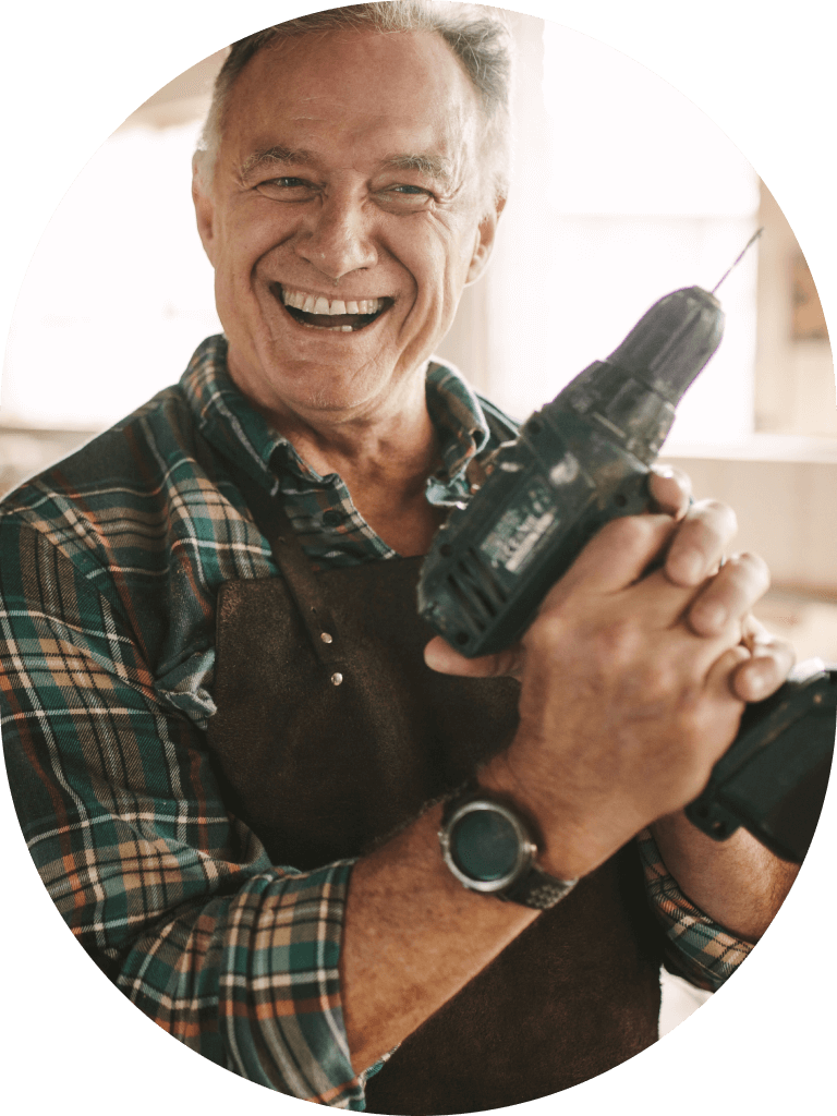Tradesman smiling holding drill